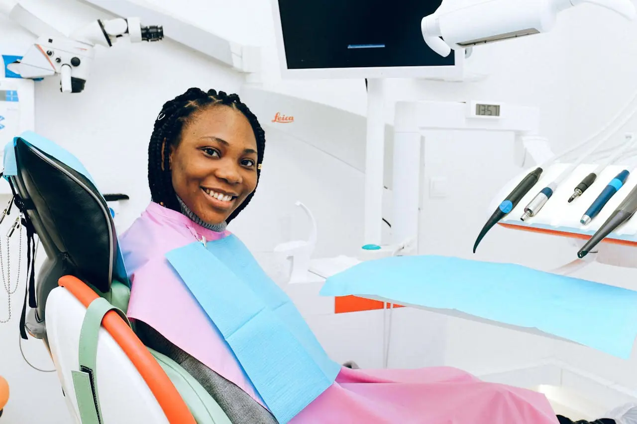 woman smiling sitting in dentist chair