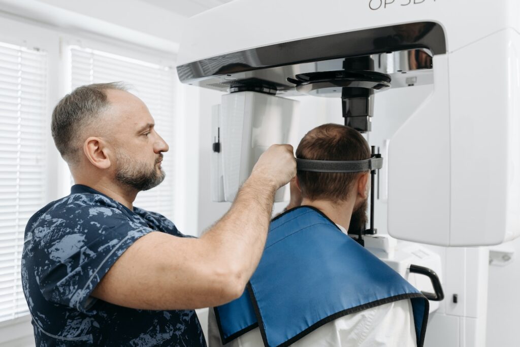 dentist giving patient a cbct scan